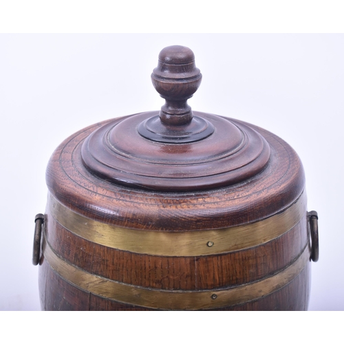 441 - A late Victorian 19th century oak & brass bound lidded Naval rum barrel. The barrel having a turned ... 