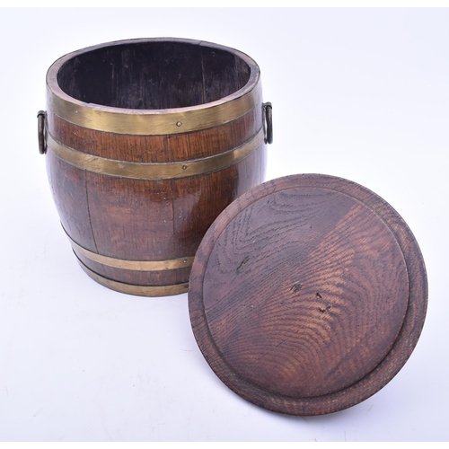 441 - A late Victorian 19th century oak & brass bound lidded Naval rum barrel. The barrel having a turned ... 