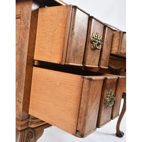 442 - An early 20th century Queen Anne revival burr walnut inverted breakfront writing desk / table. The d... 