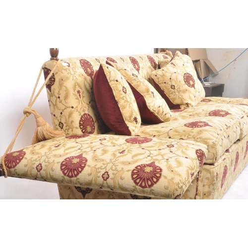 449 - A 20th century Knole / Knoll drop arm upholstered three seater settee / sofa. The sofa having a stra... 