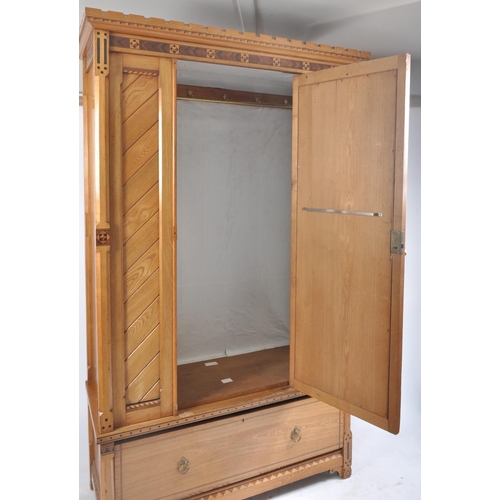 450 - A 19th century Victorian Arts & Crafts ash and specimen wood inlaid single wardrobe armoire. The war... 