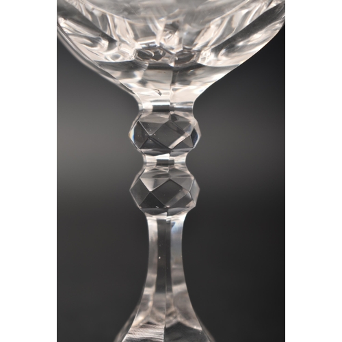 452 - A George III 18th century crystal champagne faceted flute glass, conical bowl with elongated knop. R... 