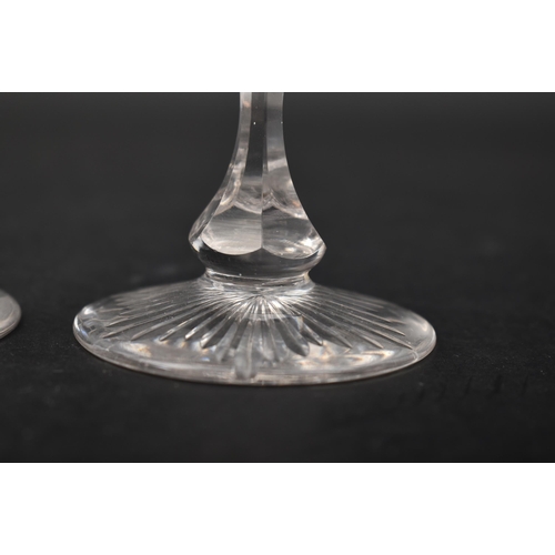 452 - A George III 18th century crystal champagne faceted flute glass, conical bowl with elongated knop. R... 