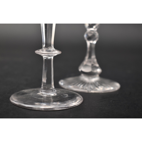 452 - A George III 18th century crystal champagne faceted flute glass, conical bowl with elongated knop. R... 