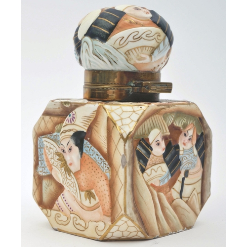 455 - A 19th century Japanese Oriental porcelain cuboid figurative lidded inkwell. The inkwell having a bu... 