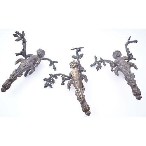 46 - A set of three Victorian 19th century cast bronze wall lights fittings. Each wall light in the shape... 