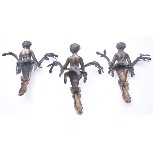 46 - A set of three Victorian 19th century cast bronze wall lights fittings. Each wall light in the shape... 