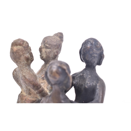 467 - A collection of four 19th century tribal style erotic bronze / iron figurines depicting pairs of lov... 