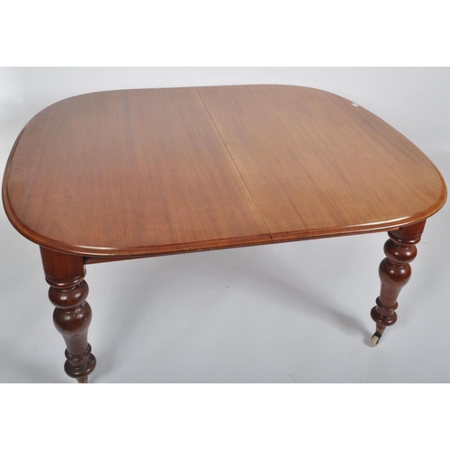 473 - A 19th century mahogany revival dining table with chairs. The suite comprising of a mahogany oval to... 