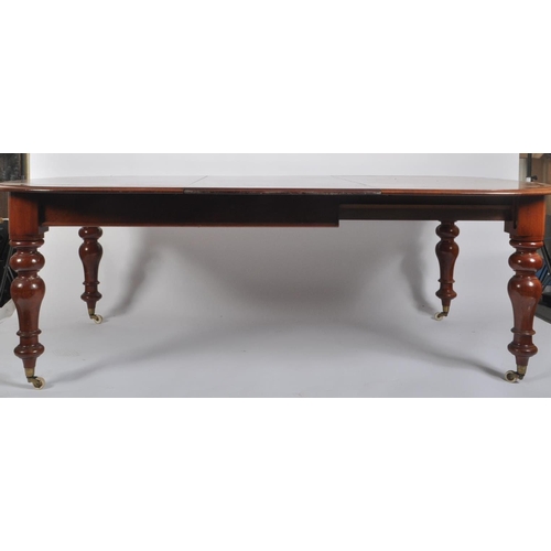 473 - A 19th century mahogany revival dining table with chairs. The suite comprising of a mahogany oval to... 