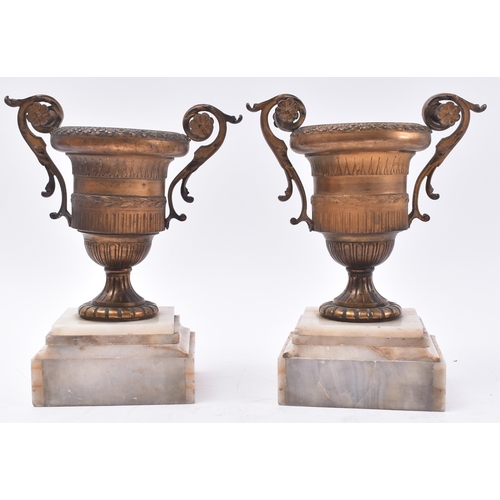 480 - A pair of 19th century French Empire style gilt bronze urns. Each urn of classical form with scrolle... 