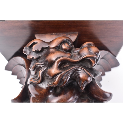 51 - A 19th century French carved hardwood in the shape of a dragon wall bracket. The bracket having a br... 