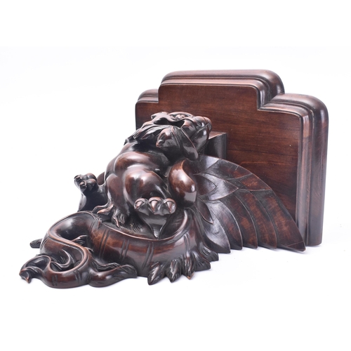 51 - A 19th century French carved hardwood in the shape of a dragon wall bracket. The bracket having a br... 