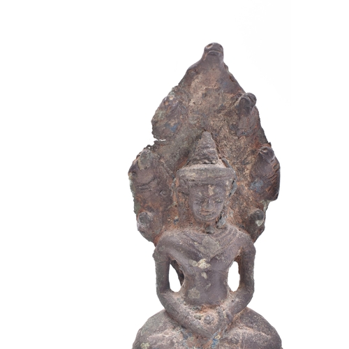 635 - A Khmer Cambodian Naga enthroned bronze Buddha figure, circa 12th century AD. The Buddah figure sat ... 