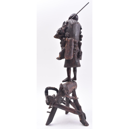 636 - A 19th century Japanese carved root wood figure of a fisherman. The carving stood upright with rod o... 