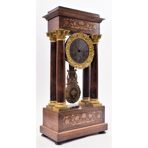 64 - A 19th century continental French rosewood & mahogany inlay Portico mantel clock. The clock having a... 