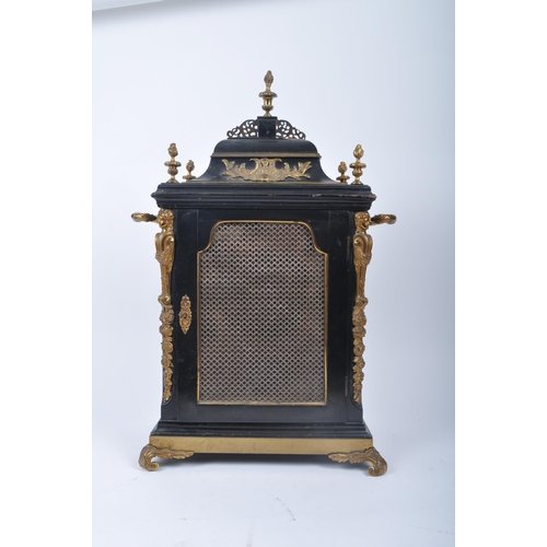 640 - A Victorian 19th century gilt ormolu & ebonised wood eight bells musical bracket clock. The clock ha... 