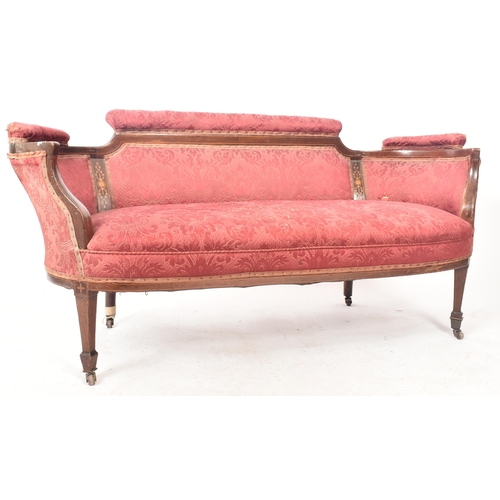 644 - An Edwardian mahogany inlaid framed two seater salon sofa / settee. The sofa having a shaped padded ... 