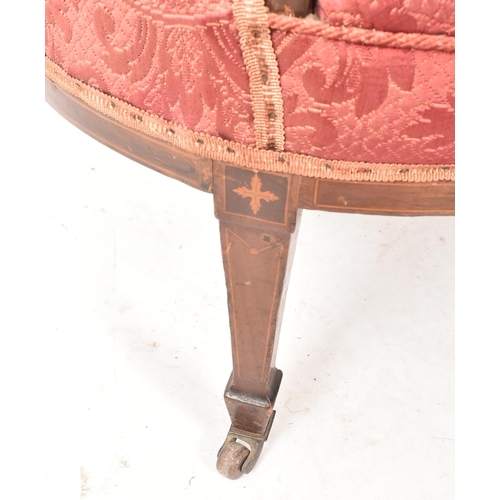 644 - An Edwardian mahogany inlaid framed two seater salon sofa / settee. The sofa having a shaped padded ... 