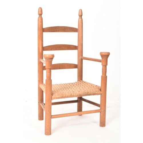 651 - A 19th century Country house maple ladder back child's chair. The chair with two upright backrest su... 