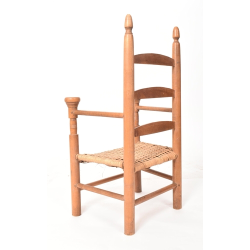 651 - A 19th century Country house maple ladder back child's chair. The chair with two upright backrest su... 