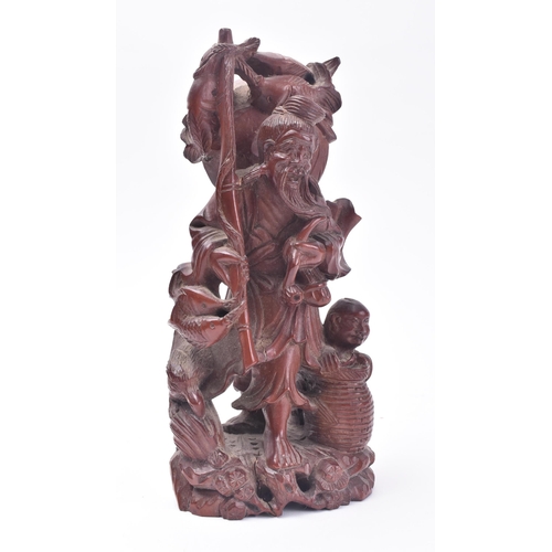 653 - A 19th century Chinese carved wooden fisherman & boy. The carving with basket, bird & boy. Believed ... 