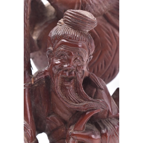 653 - A 19th century Chinese carved wooden fisherman & boy. The carving with basket, bird & boy. Believed ... 