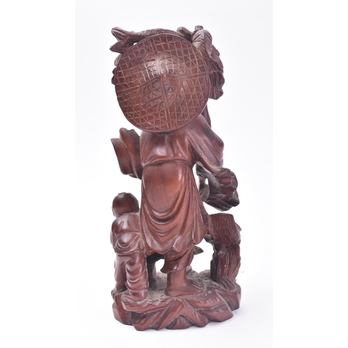 653 - A 19th century Chinese carved wooden fisherman & boy. The carving with basket, bird & boy. Believed ... 