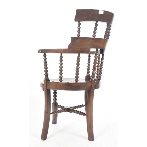 654 - A Victorian 19th century mahogany bobbin turned high back magistrate armchair. The chair having a tw... 