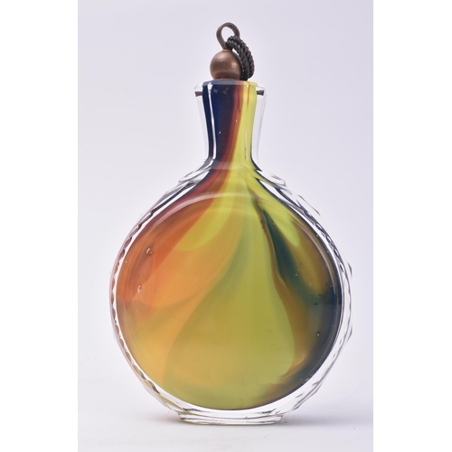 659 - A 20th century multicoloured cased glass flask / bottle. Small pair of picks to the copper cover wit... 