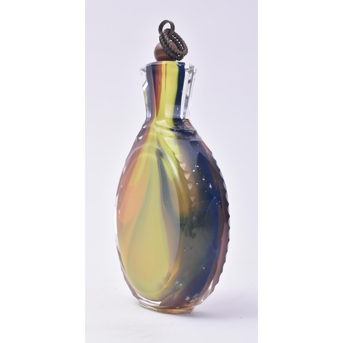 659 - A 20th century multicoloured cased glass flask / bottle. Small pair of picks to the copper cover wit... 