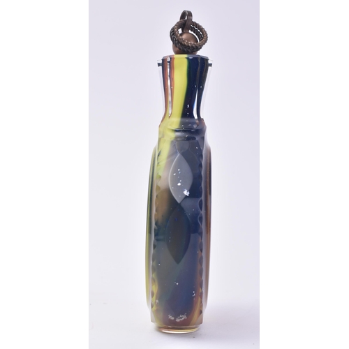 659 - A 20th century multicoloured cased glass flask / bottle. Small pair of picks to the copper cover wit... 