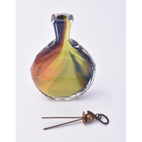 659 - A 20th century multicoloured cased glass flask / bottle. Small pair of picks to the copper cover wit... 