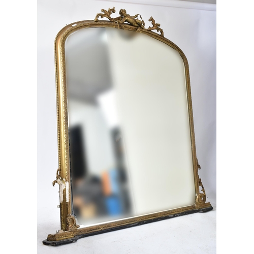 79 - A large Victorian 19th century gilt wood & gesso over mantle mirror. The mirror having an intricate ... 