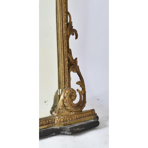 79 - A large Victorian 19th century gilt wood & gesso over mantle mirror. The mirror having an intricate ... 