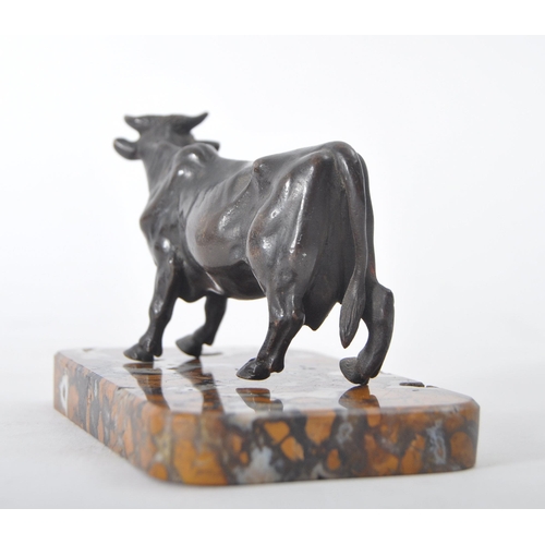 86 - A 19th century continental French inspired bronze  cow figure. The bronze sculpture with turned head... 