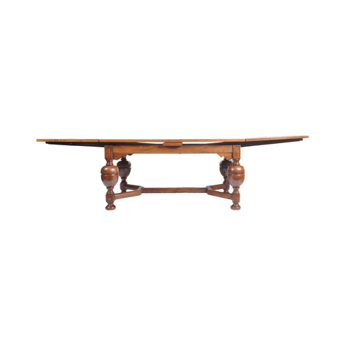 144 - A 1900s large oak and parquetry draw leaf refectory dining table in the manner of Rubens. Of Flemish... 