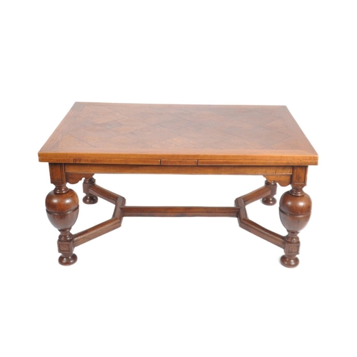 144 - A 1900s large oak and parquetry draw leaf refectory dining table in the manner of Rubens. Of Flemish... 