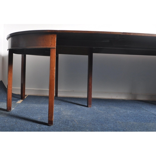 193 - An 18th century George III mahogany D end extending dining table. Comprises two demi lune ends with ... 