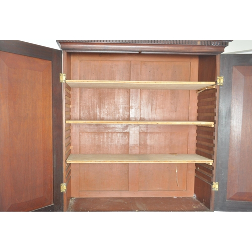 212 - A 19th century George III mahogany estate bookcase bureau. The bureau with twin fielded panel doors ... 