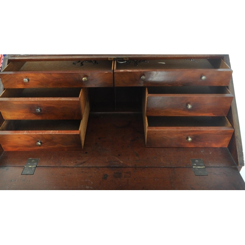 212 - A 19th century George III mahogany estate bookcase bureau. The bureau with twin fielded panel doors ... 