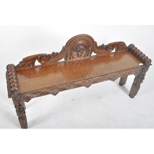 278 - A Victorian 19th century carved solid oak hall settle bench. The bench having an intricately carved ... 