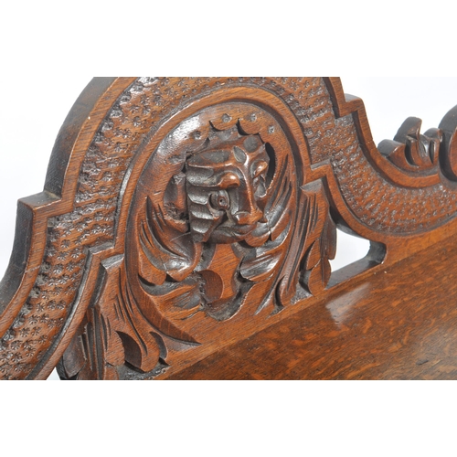 278 - A Victorian 19th century carved solid oak hall settle bench. The bench having an intricately carved ... 