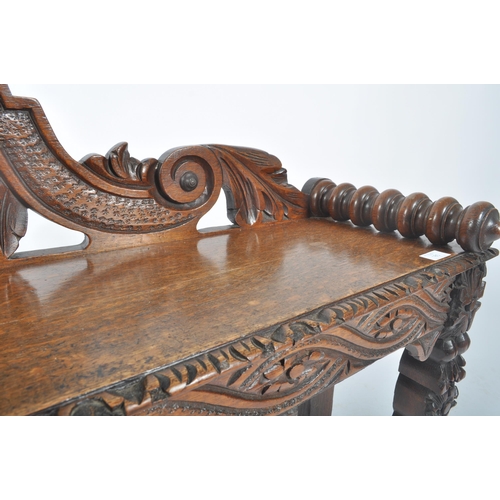 278 - A Victorian 19th century carved solid oak hall settle bench. The bench having an intricately carved ... 