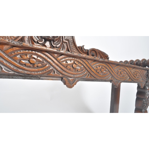 278 - A Victorian 19th century carved solid oak hall settle bench. The bench having an intricately carved ... 