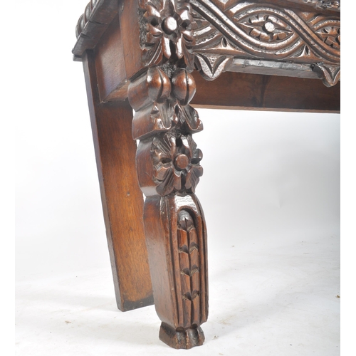 278 - A Victorian 19th century carved solid oak hall settle bench. The bench having an intricately carved ... 