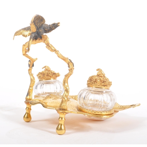 320 - A mid - late 19th century Victorian gilt metal and mother of pearl inkwell. The inkwell with decorat... 