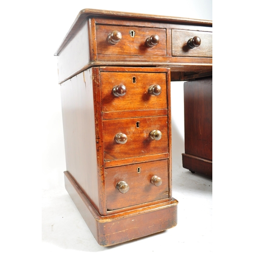 208 - A Victorian 19th century stained mahogany twin pedestal desk. The kneehole desk having a red leather... 