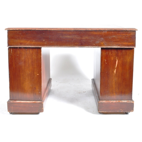 208 - A Victorian 19th century stained mahogany twin pedestal desk. The kneehole desk having a red leather... 