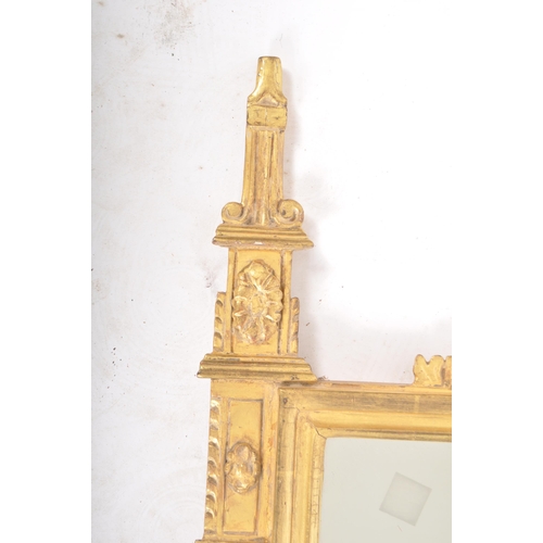 244 - An early 19th century Regency giltwood hall wall mirror having a florally carved top cresting flanke... 